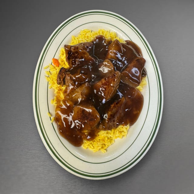 Marinated Beef Tips Over Rice Special.